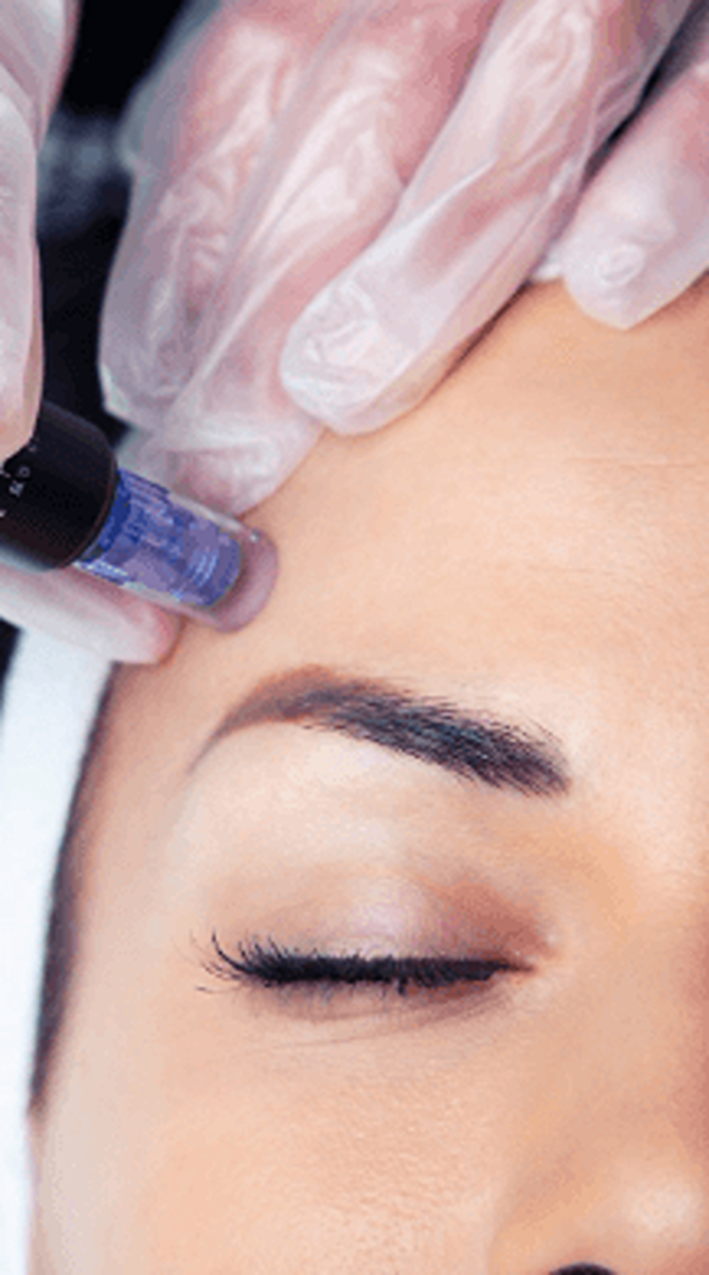 Woman having a face treatment at beauty artist studio